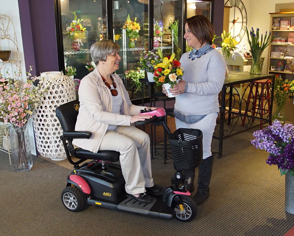 Mothers Day at the Flower Shop in a Pink Buzzaround scooter